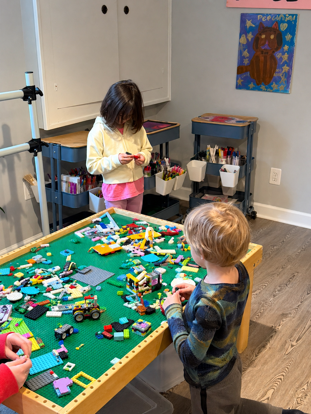 Children playing with LEGO in the Creative Kids Zone — Ms. Melanie's finished basement creative space